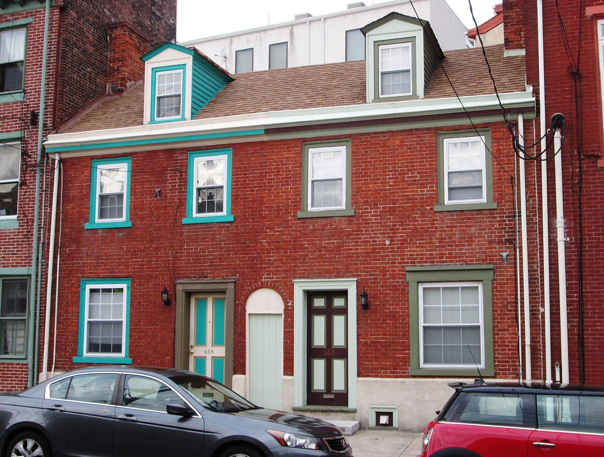 A painted brick rowhome on North 4th Street. Three storeys, no front yard, parking that is somebody else's problem.