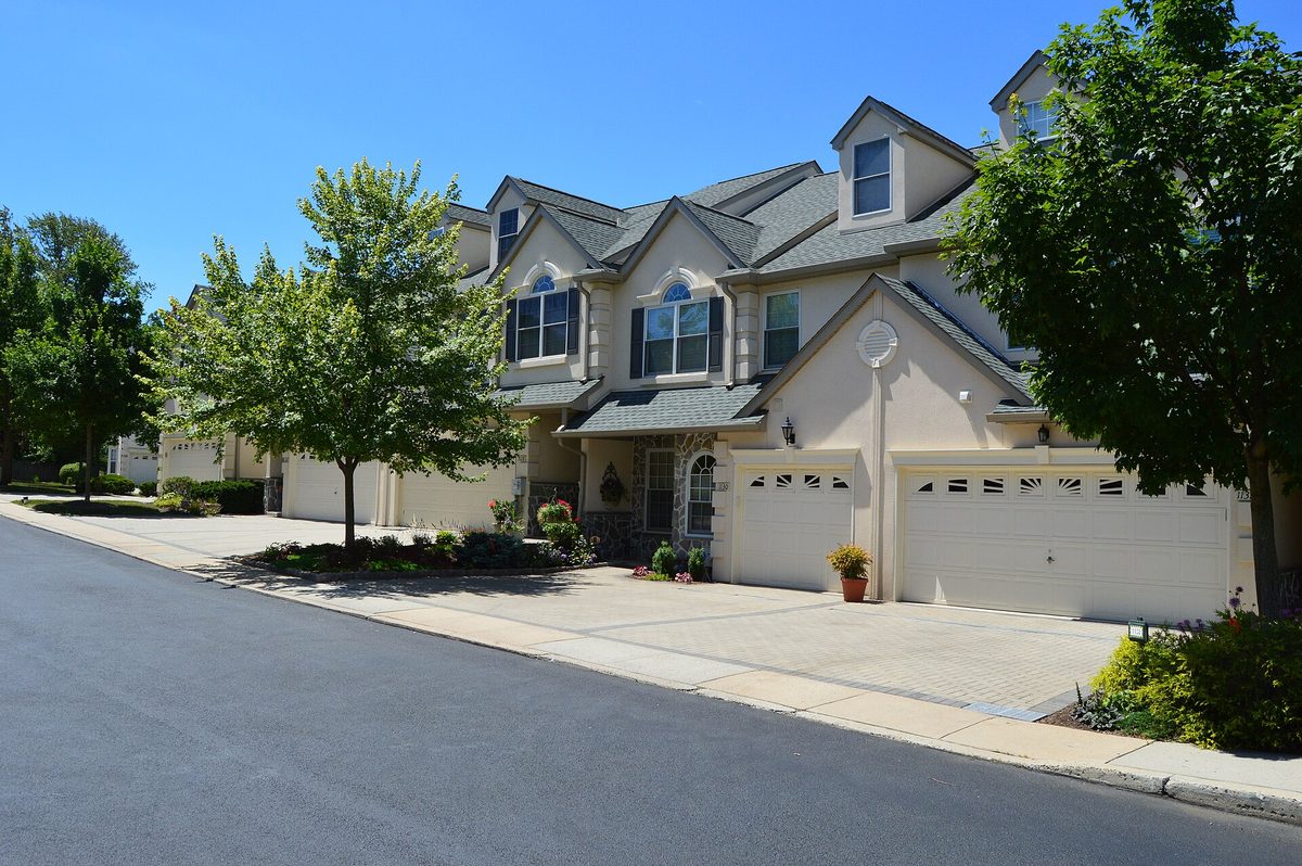 Newer townhouses with attached garages in Upper Merion, the King of Prussia stock that comes with an HOA.