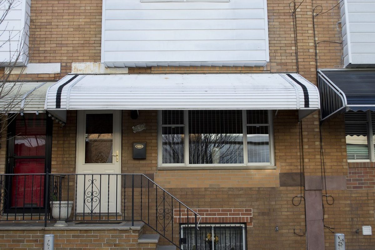 The awning, the stoop, the basement window. Most of this city's housing stock looks close to this.
